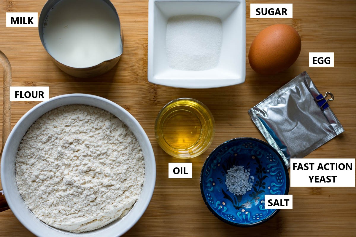 Ingredients for yeast pancakes on a wooden board. 