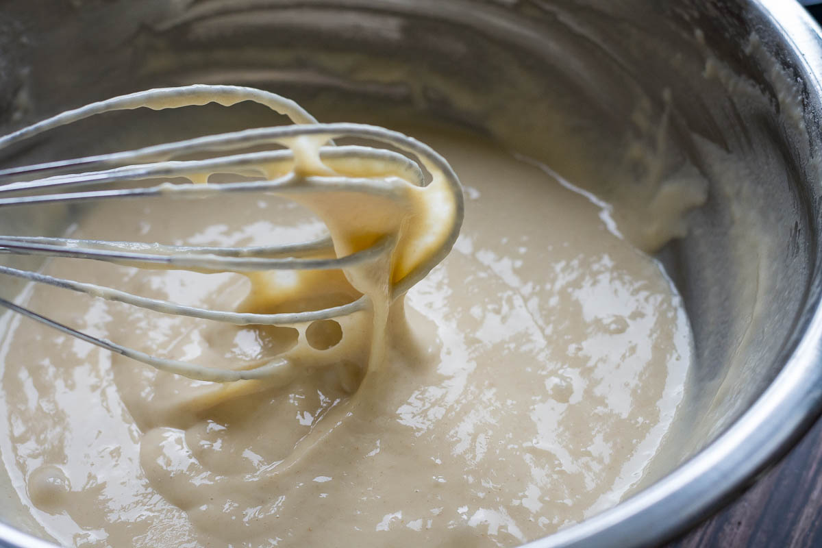 The yeast pancake batter of the consistency that resembles sour cream in a metal bowl. 