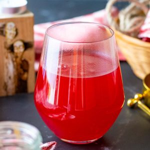 Cranberry kissel on a black table.