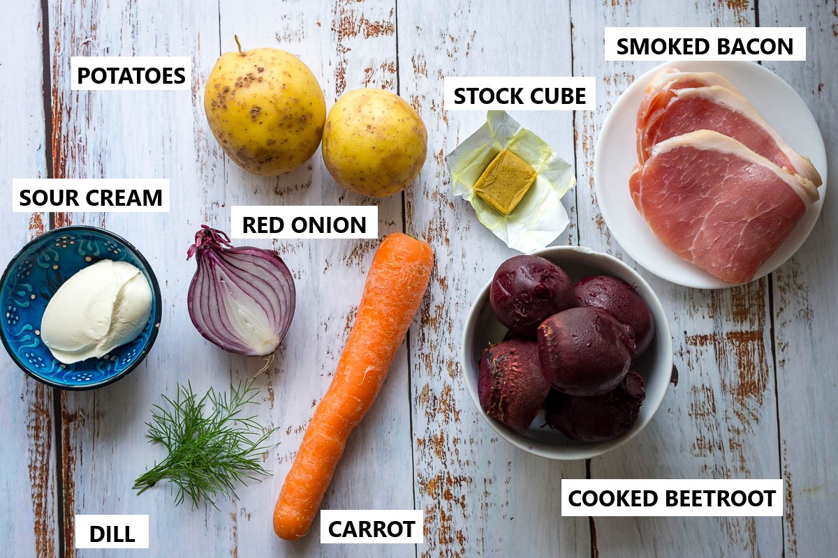 Ingredients for Lithuanian Beet Soup on a wooden white table. 