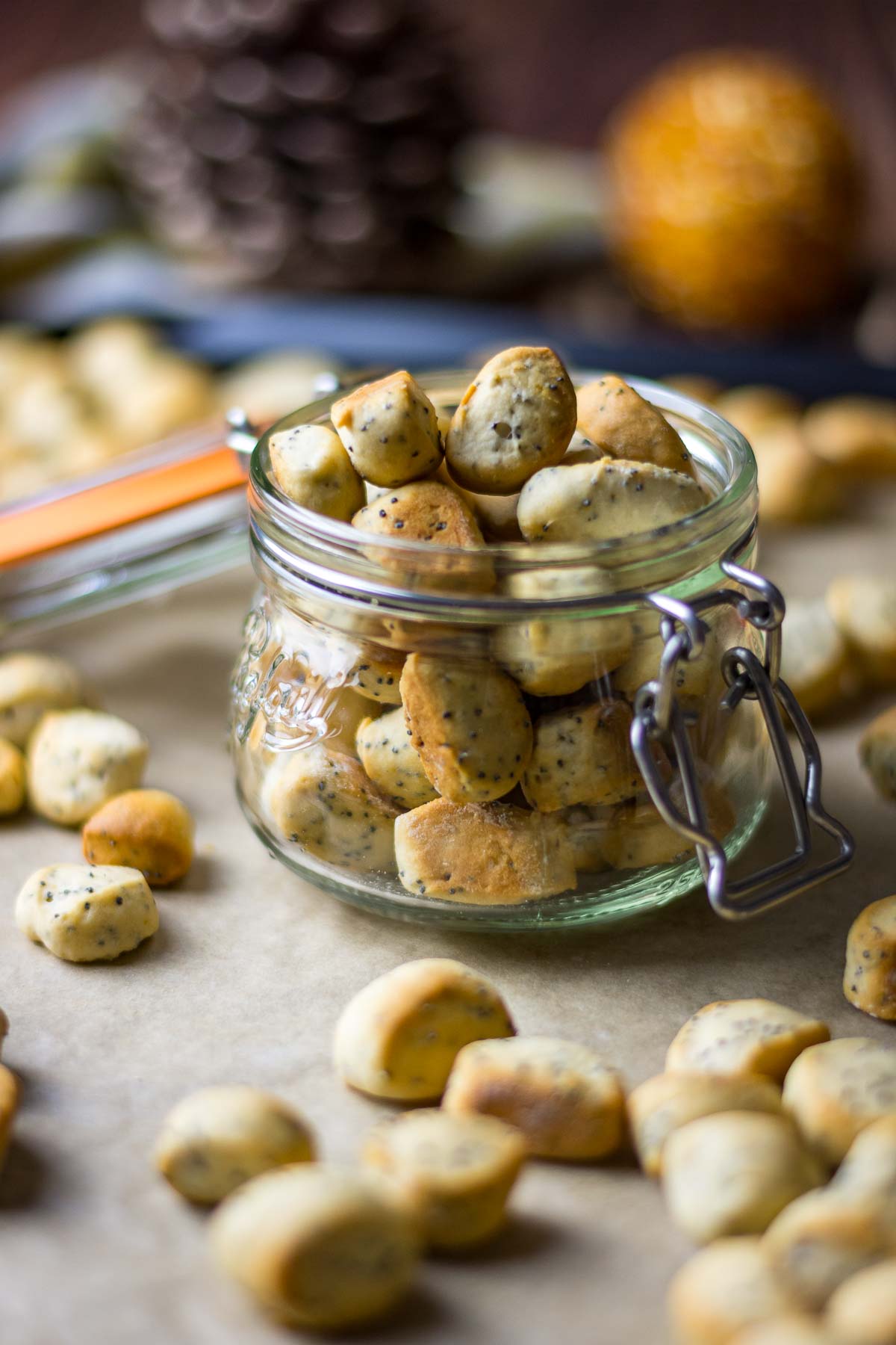 Lithuanian Christmas Eve Biscuits in a mason jar on a baking tray.