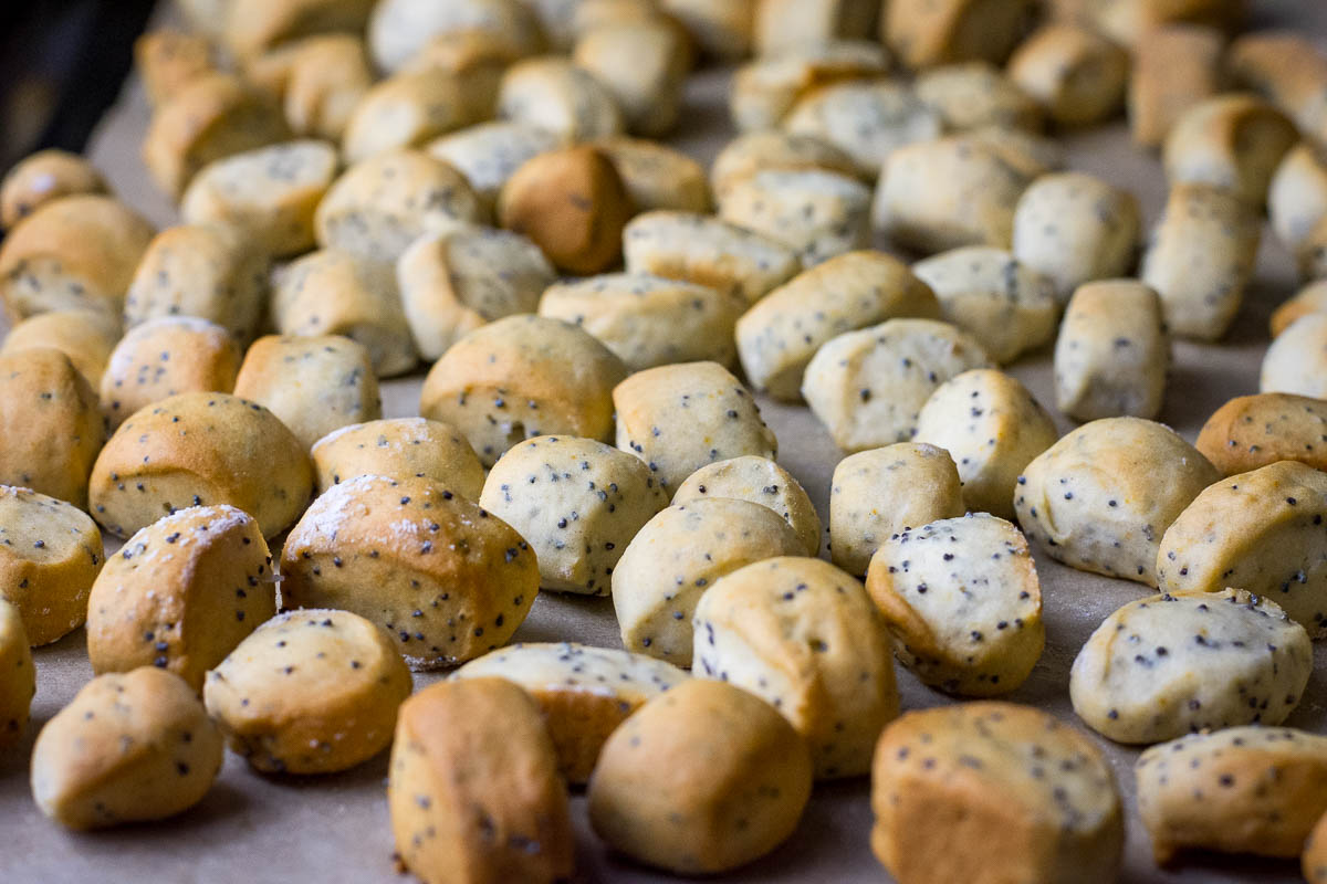 Kuciukai on a baking sheet lined with baking parchment.