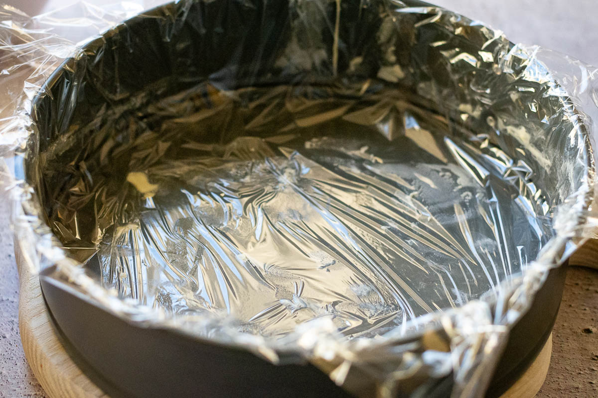 A springform cake tin lined with good-quality plastic wrap.