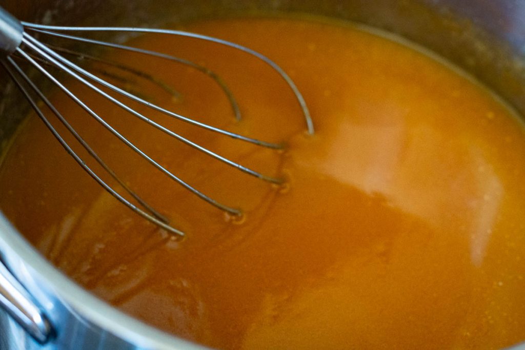 Caramel fully combined with the butter with a baloon whisk in the mixture.