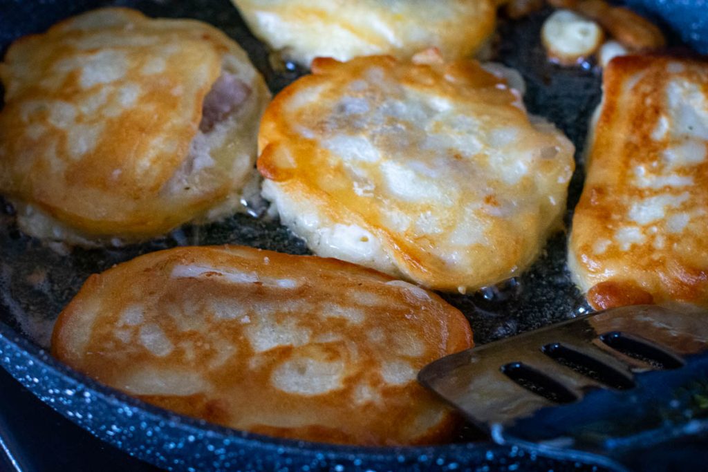 Kefir baterred fish flipped over to fry in the other side.
