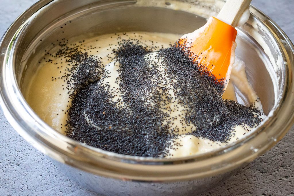 Mixing poppy seeds into the songe batter for the Kursenu Vyniotinis.