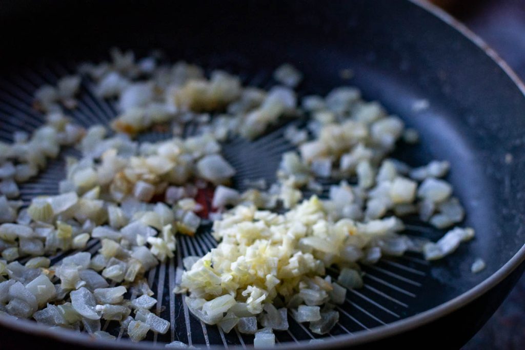 Garlic added to sauted onions. 