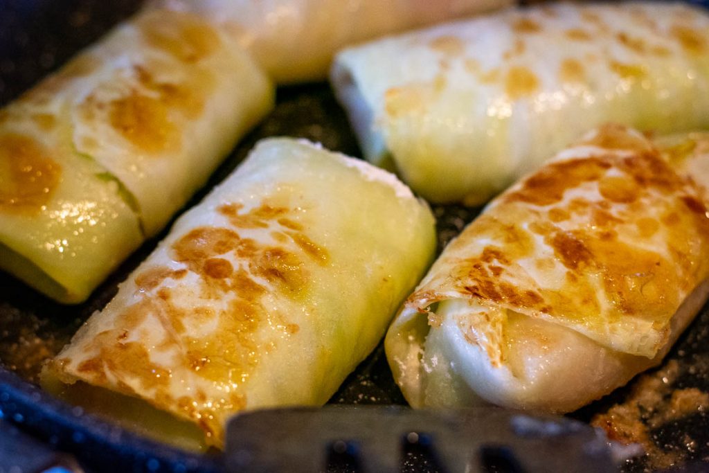 Searing the cabbage rolls in a arge frying pan. 