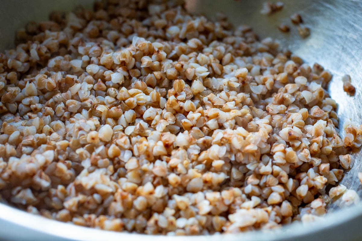 boiled buckwheat in a large metal bowl.