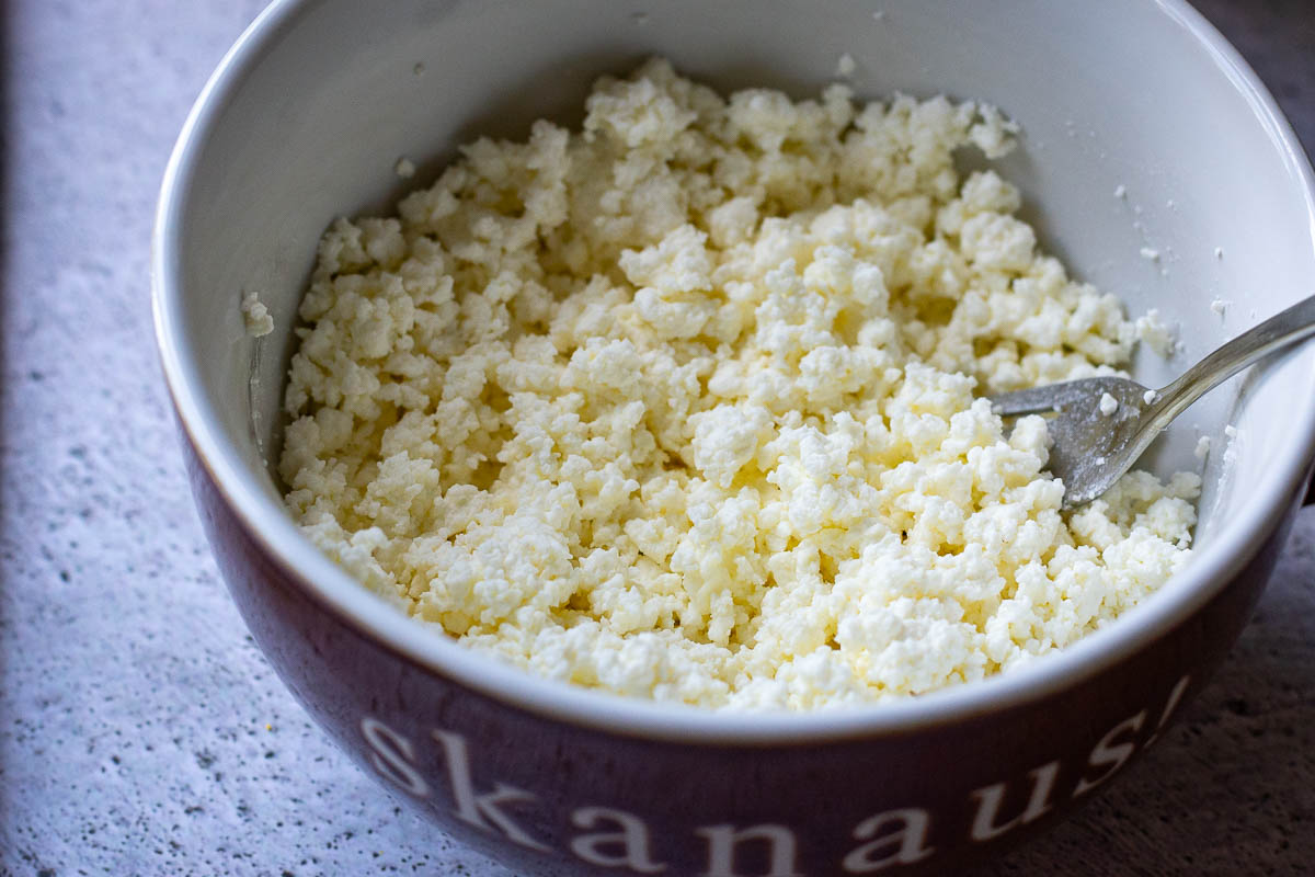 Farmers cheese fluffed up with a fork.