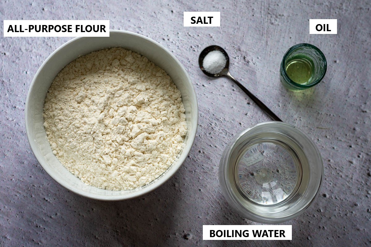 Ingredients for Miltiniai Ežiukai (Lithuanian Flour dumplings) on a light greay surface.