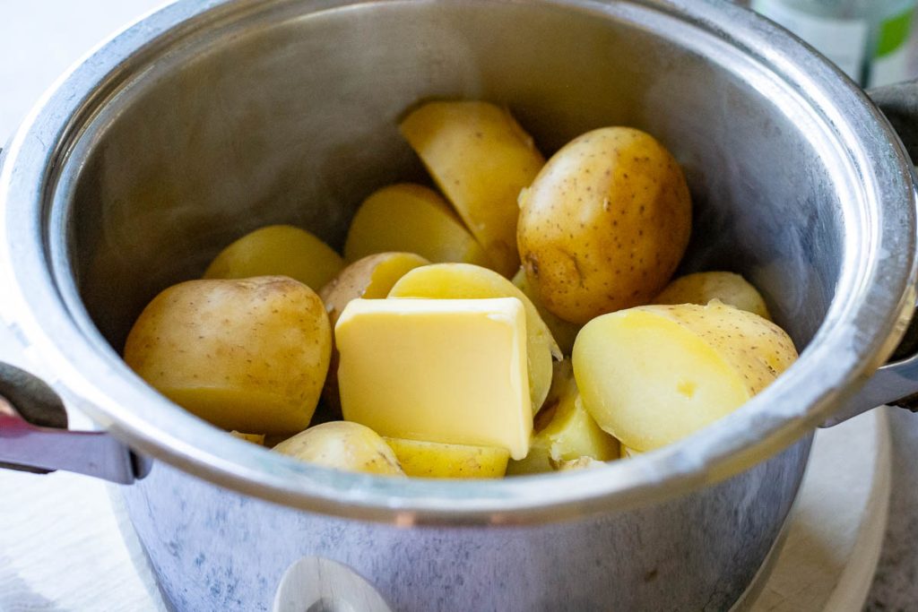 Butter added to boiled potatoes.