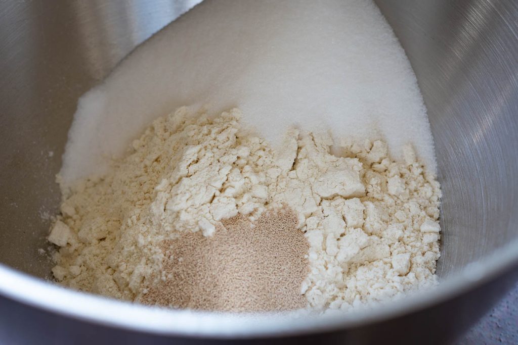 Dry ingredients for Lithuanian bun dough in a large mixing bowl. 