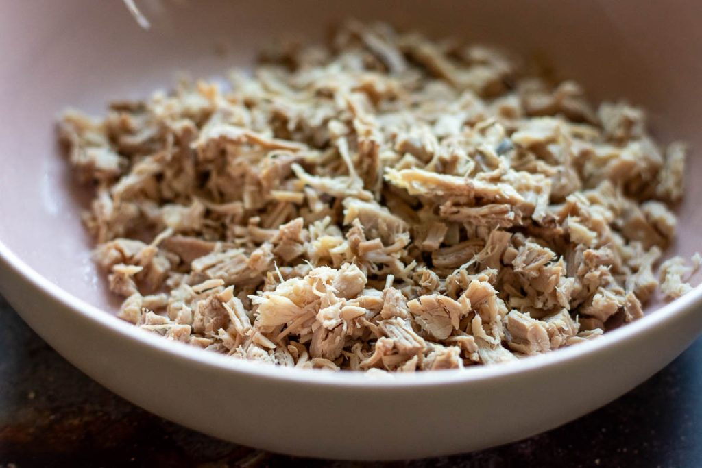 Very finely shredded cooked pork.
