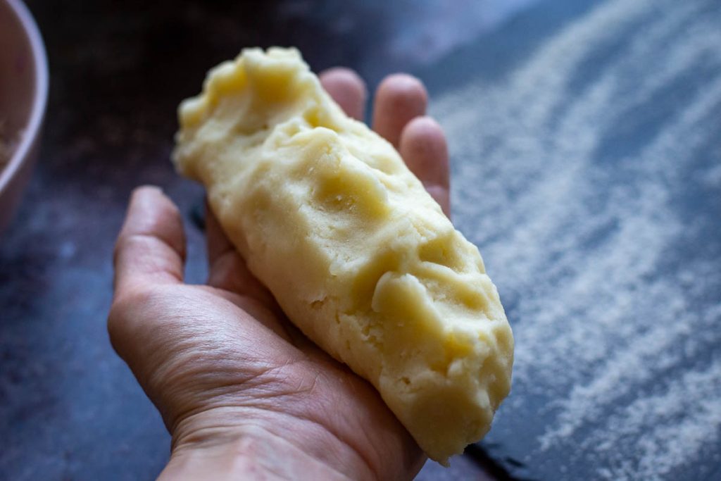 Meat filling encased in a potato dough to shape a samogitian pancake.