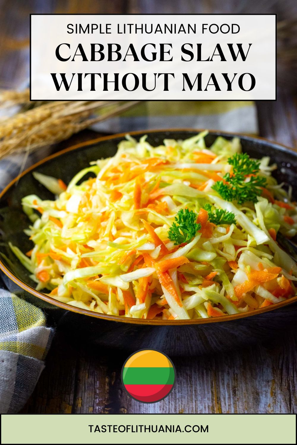 Lithuanian Cabage and carrot salad in a black bowl - Pin for Pinterest.