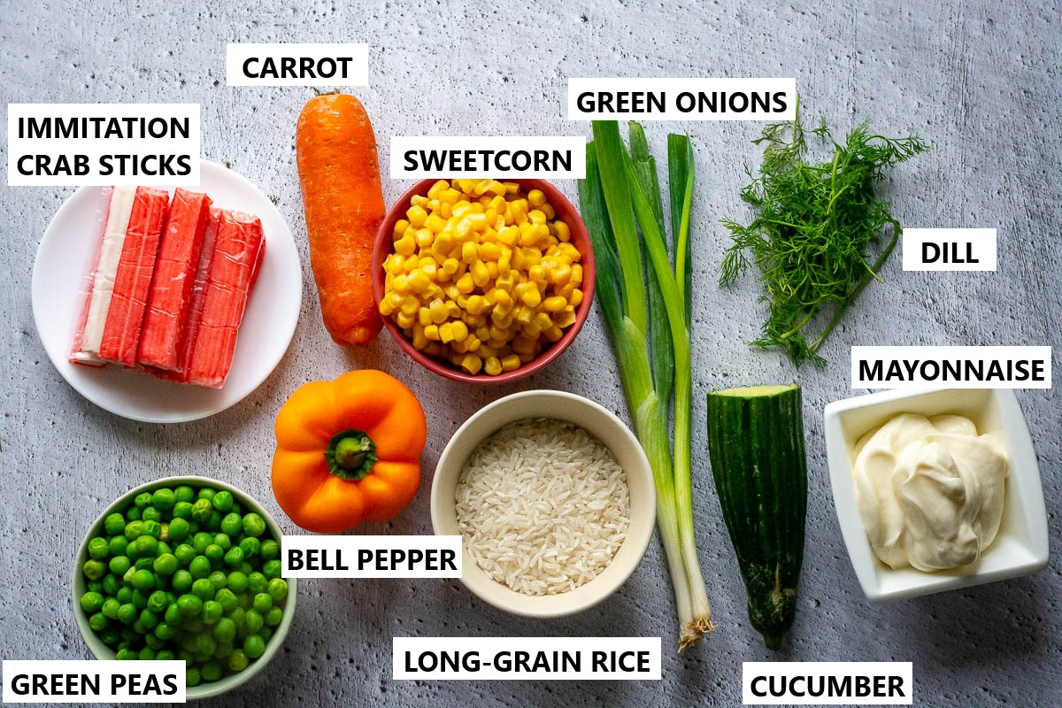 Ingredients for Lithuanian rice salad with seafood sticks.