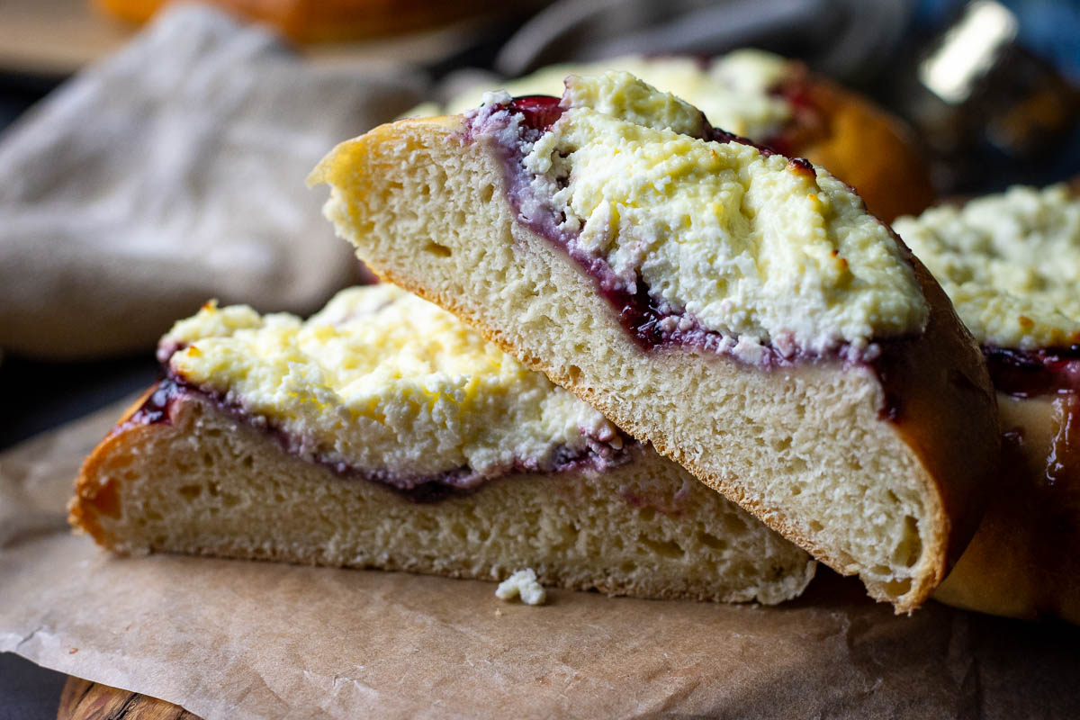 Lithuanian sweet cheese bun cut in half.