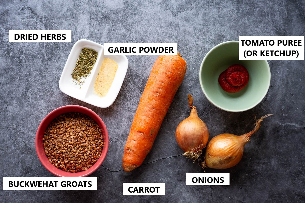 Ingredients for Lithuanian Buckwheat side dish on a dark surface.