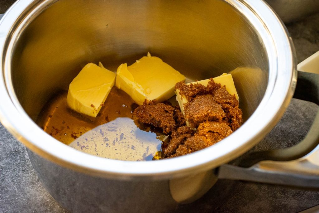 Butter, sugar and honey melting in a pot. 