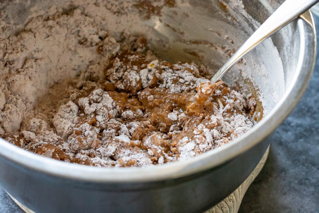 Mixing the dry ingredients with the wet. 