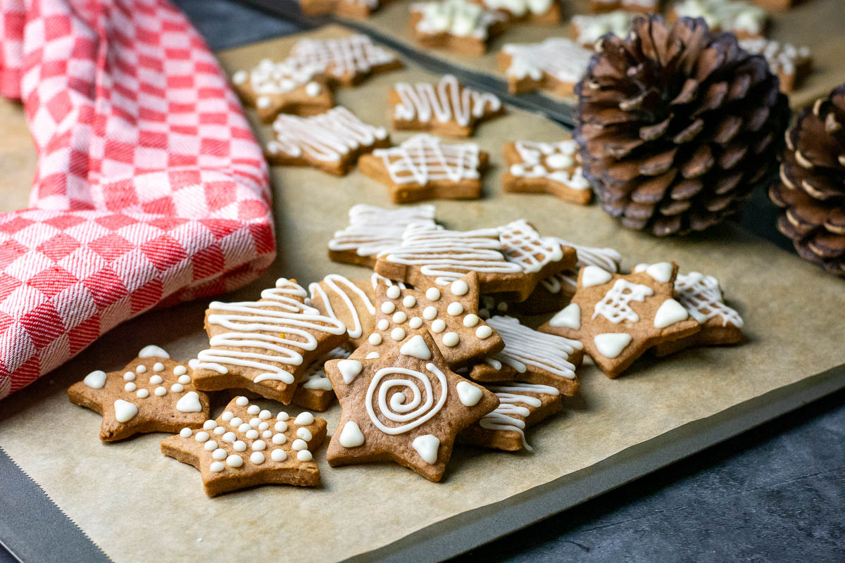 Lithuanian Christmas cookies on a baking sheet lined with parchment paper.
