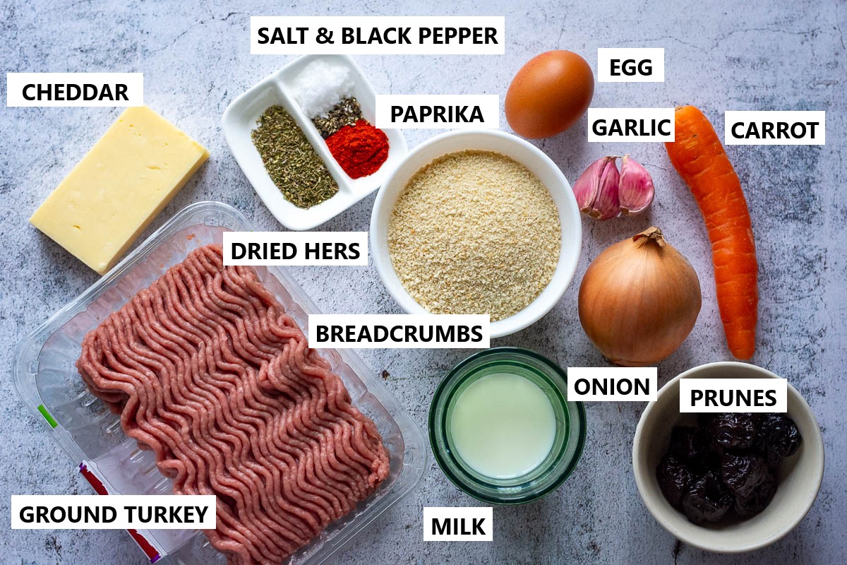 Ingredients for Turkey Meatloaf With Cheese on a grey surface.
