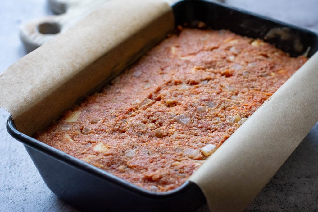 Turkey meatloaf with cheese and prunes before baking.