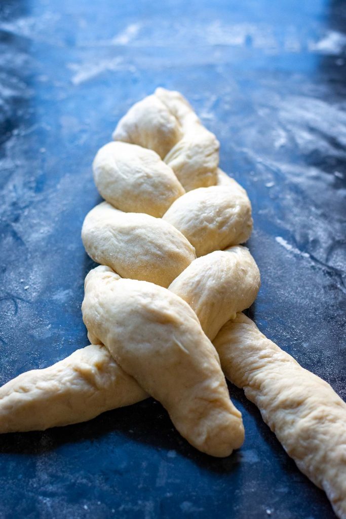 Braiding a three strand loaf. 