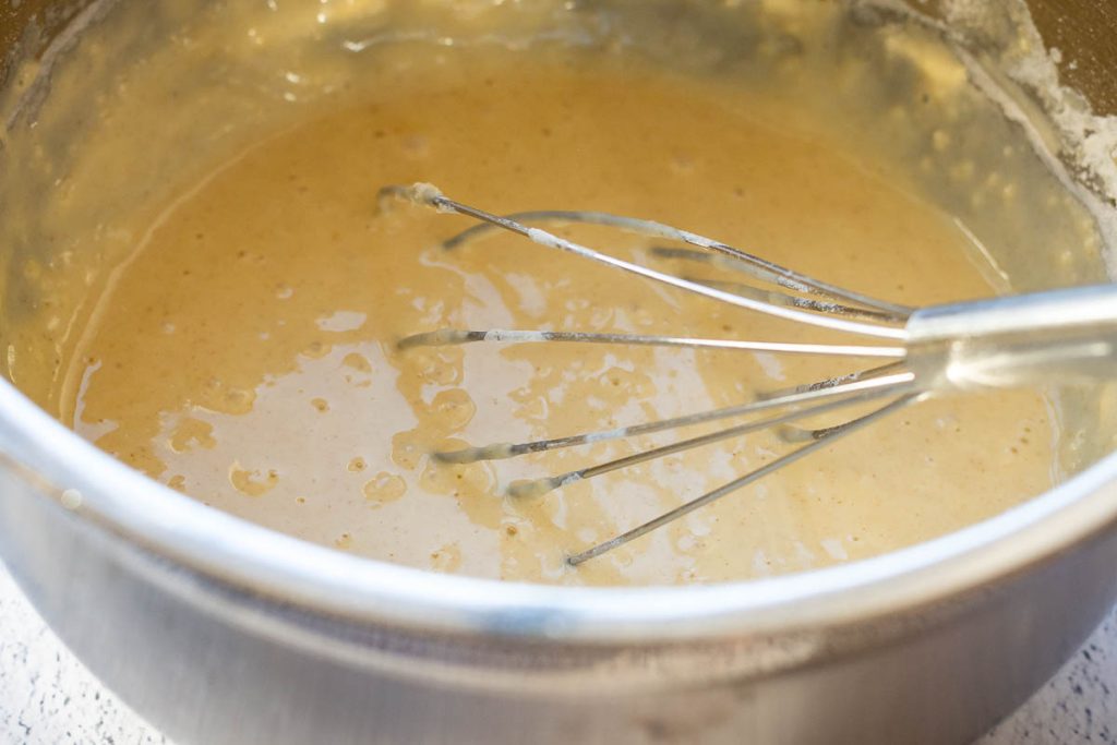 Thick crepe batter before loseing it with more milk.