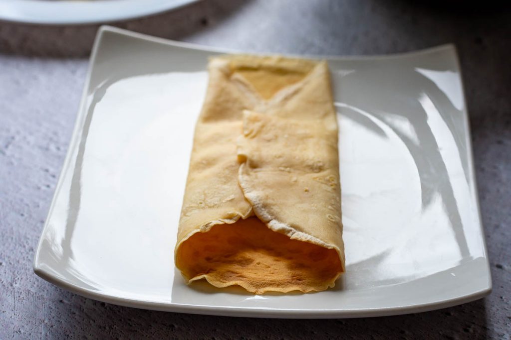 Two sides folded over the crepe filling.