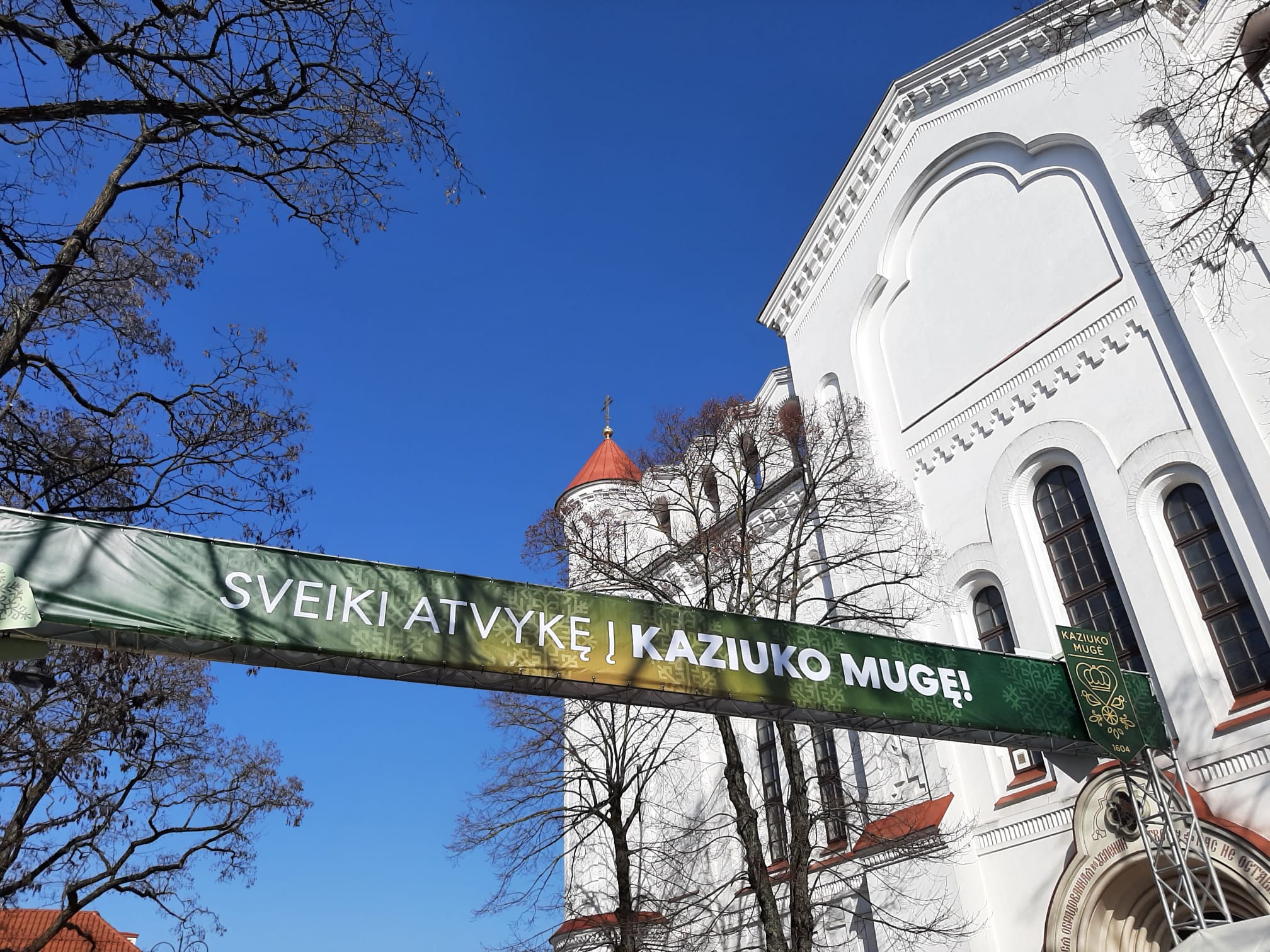 The entrance to St Casimir's fair with a banner reading: Welcome to Kaziuko Muge.