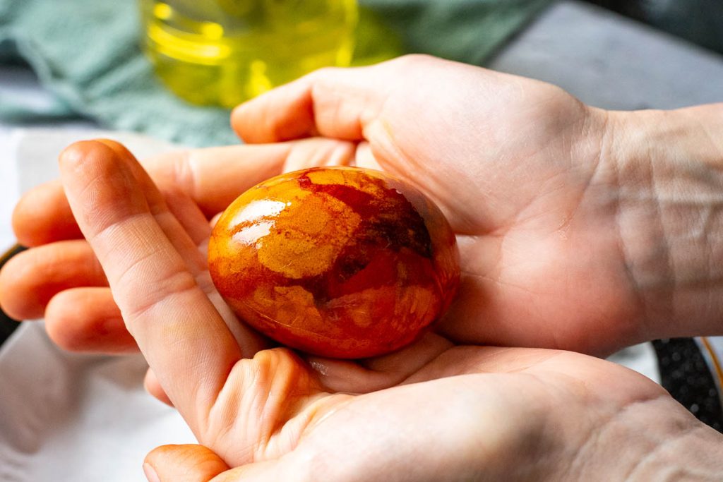 Rubbing oil onto the onion skin dyed eggs. 