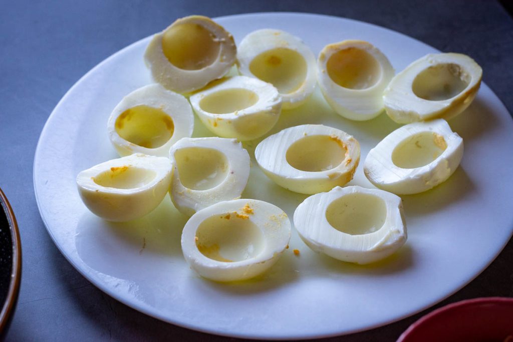 Egg white halves on a white plate.