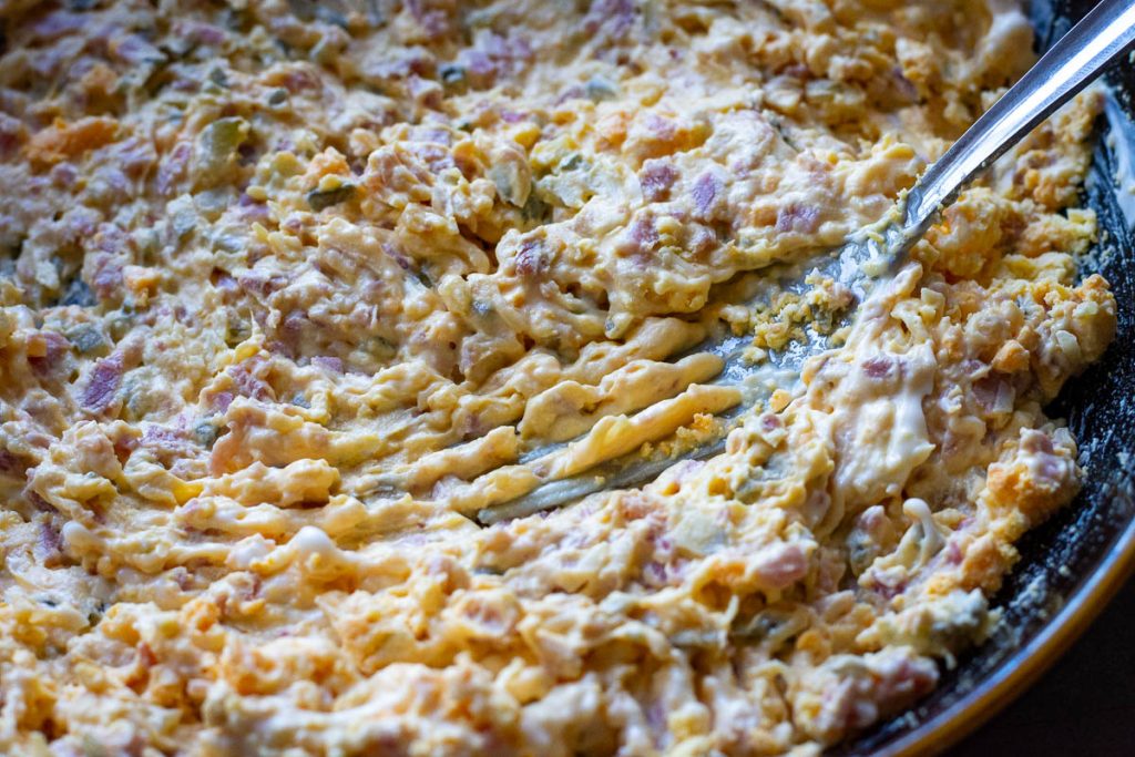 Mixed deviled egg filling in a bowl.