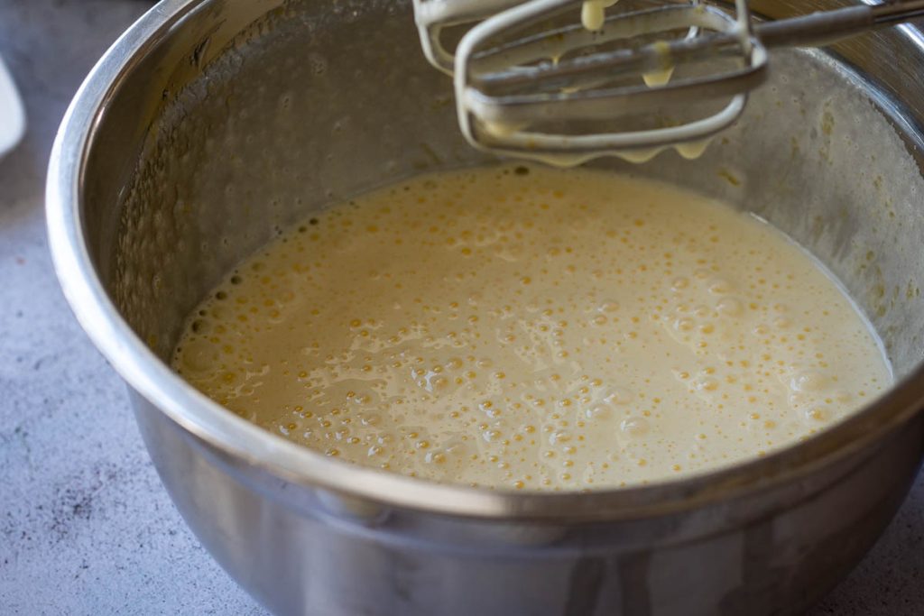 Creamy eggs and sugar mixture after beating. 