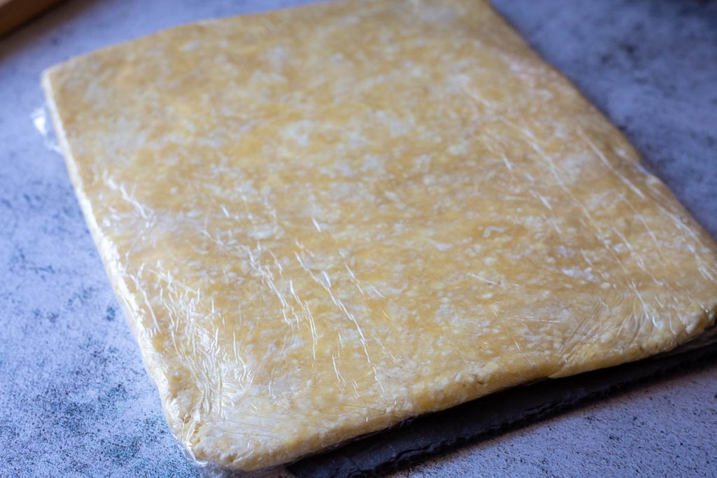 Wrapped rectangle of farmer's cheese cookie dough.