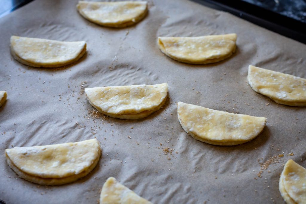 Farmer's cheese cookies folded in hald into half-moons.