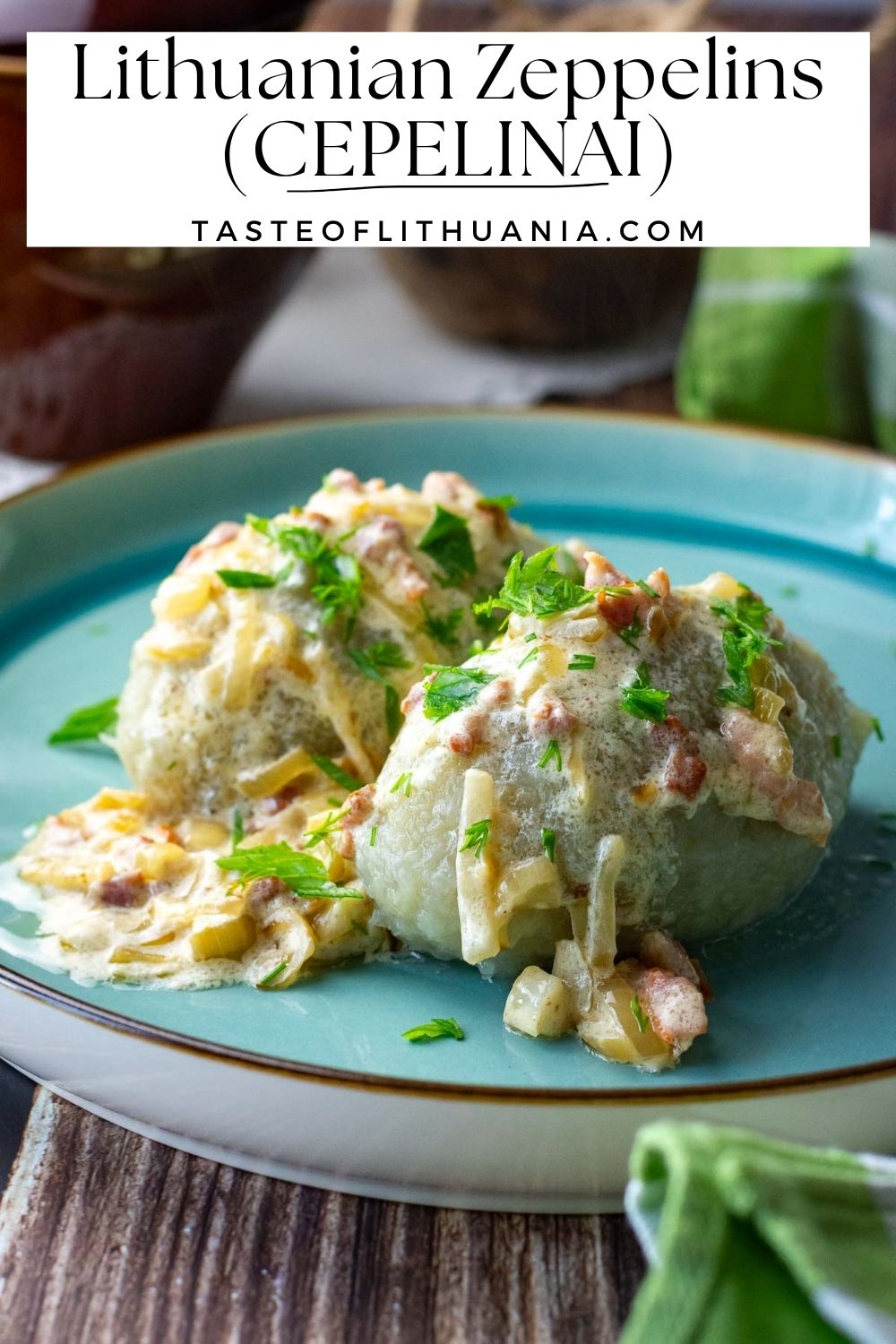 Lithuanian Zeppelins on a teal-colored plate. Pin for Pinterest.