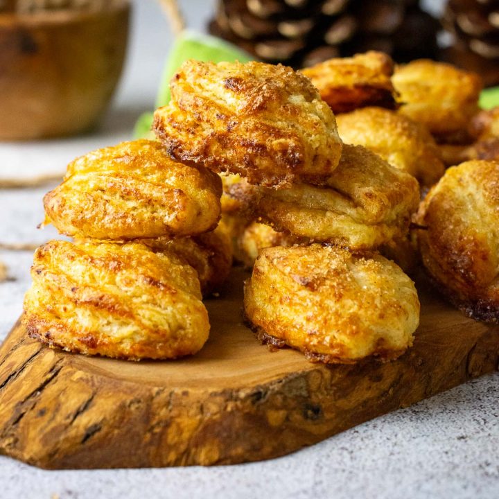Lithuanian Farmer's Cheese cookies arranged on a wooden board.