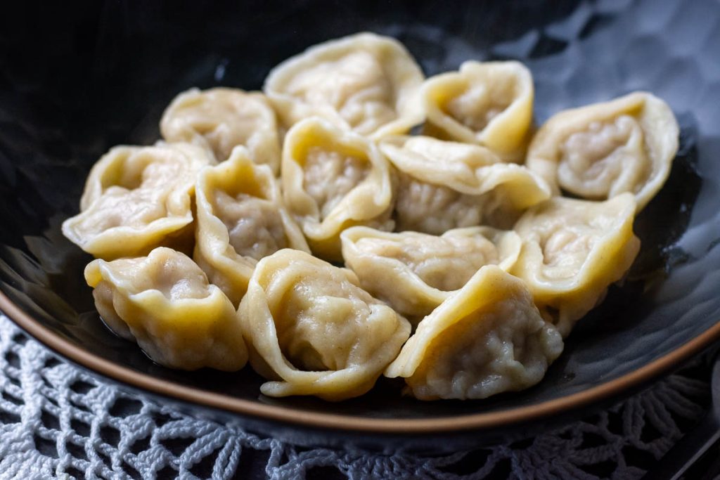 Lithuanian koldunai in a black bowl. 