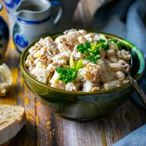 A small bowlful of Lithuanian Bean Salad With Fried Bread and Cheese.