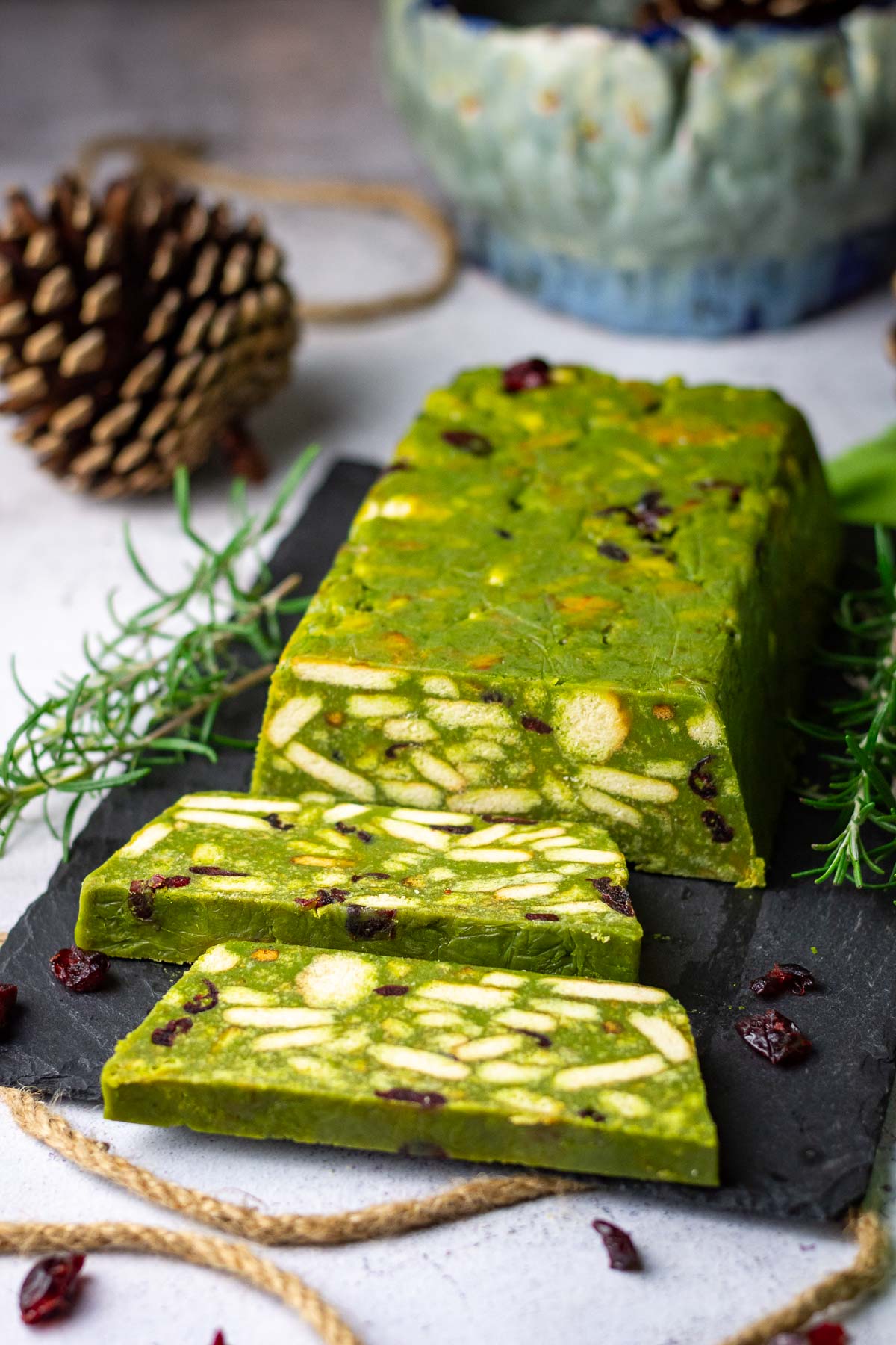 Lithuanian Lazy Cake With Matcha with two slices cut.