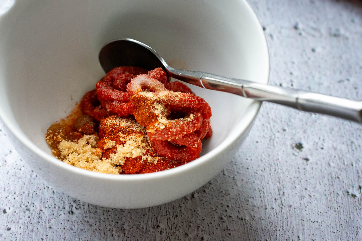 Quick rich tomato dipping sauce in a white bowl. 