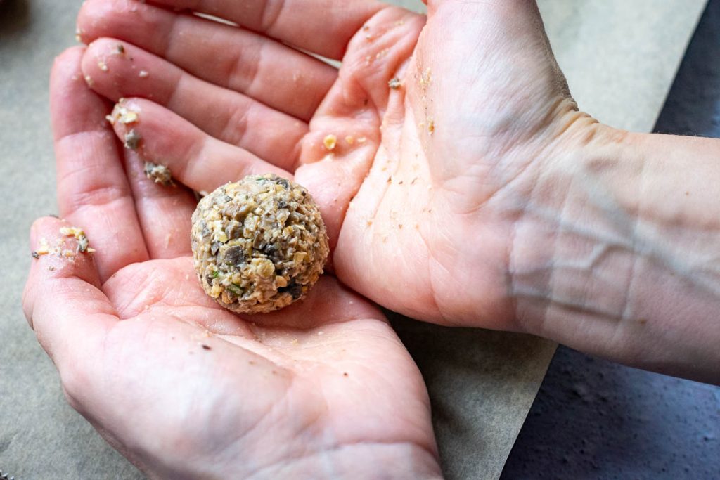 Shaping mushroom balls in the palms of the hands. 