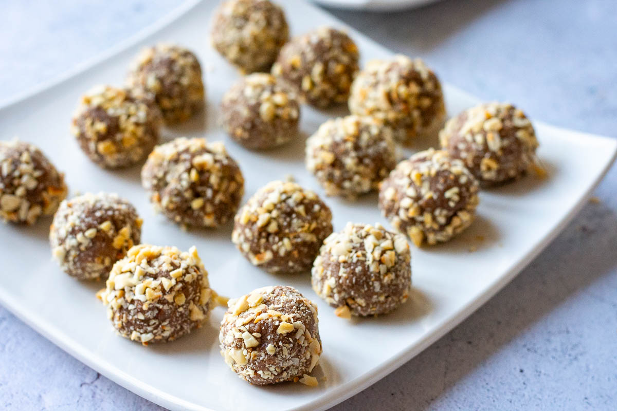 Lithuanian Chocolate condensed milk truffles rolled in chopped roasted hazelnuts.