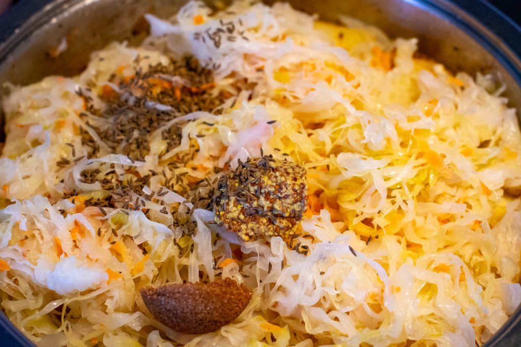 Caraway seeds, sugar and mustard added to sauerkraut.