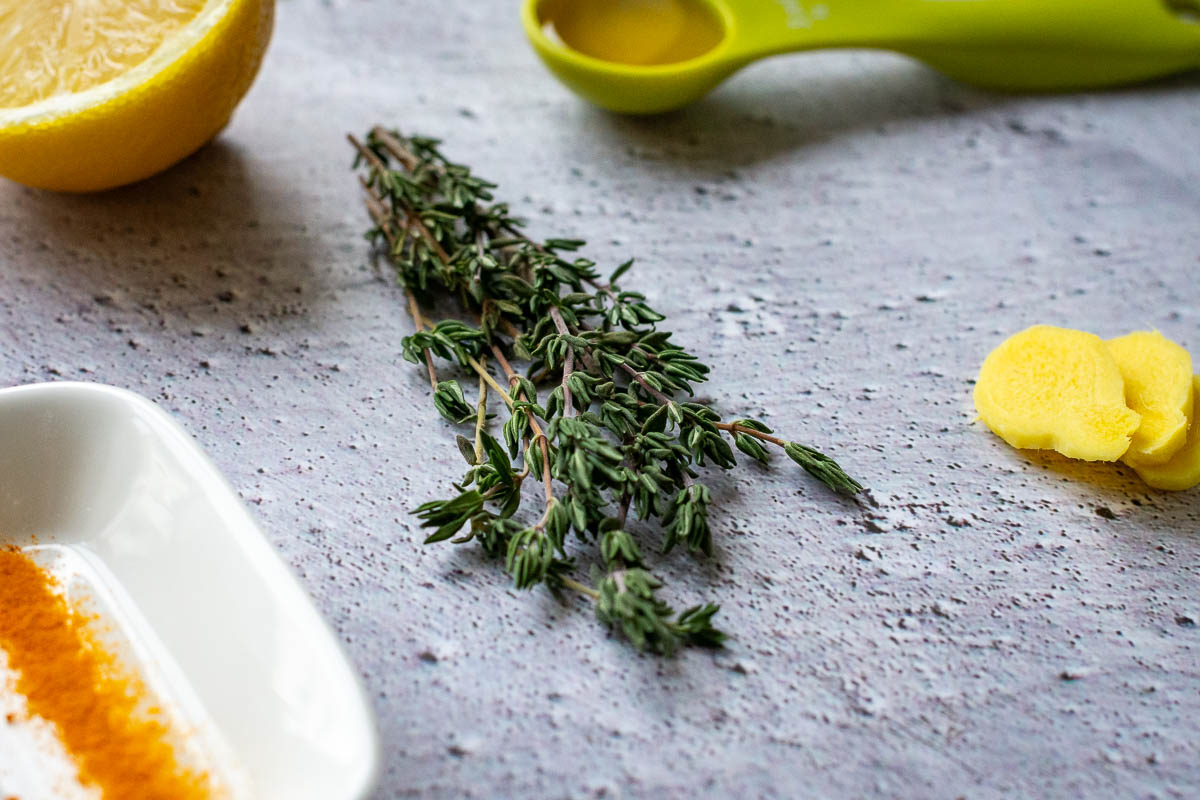 Sprigs of thyme on the kitchen worktop. 