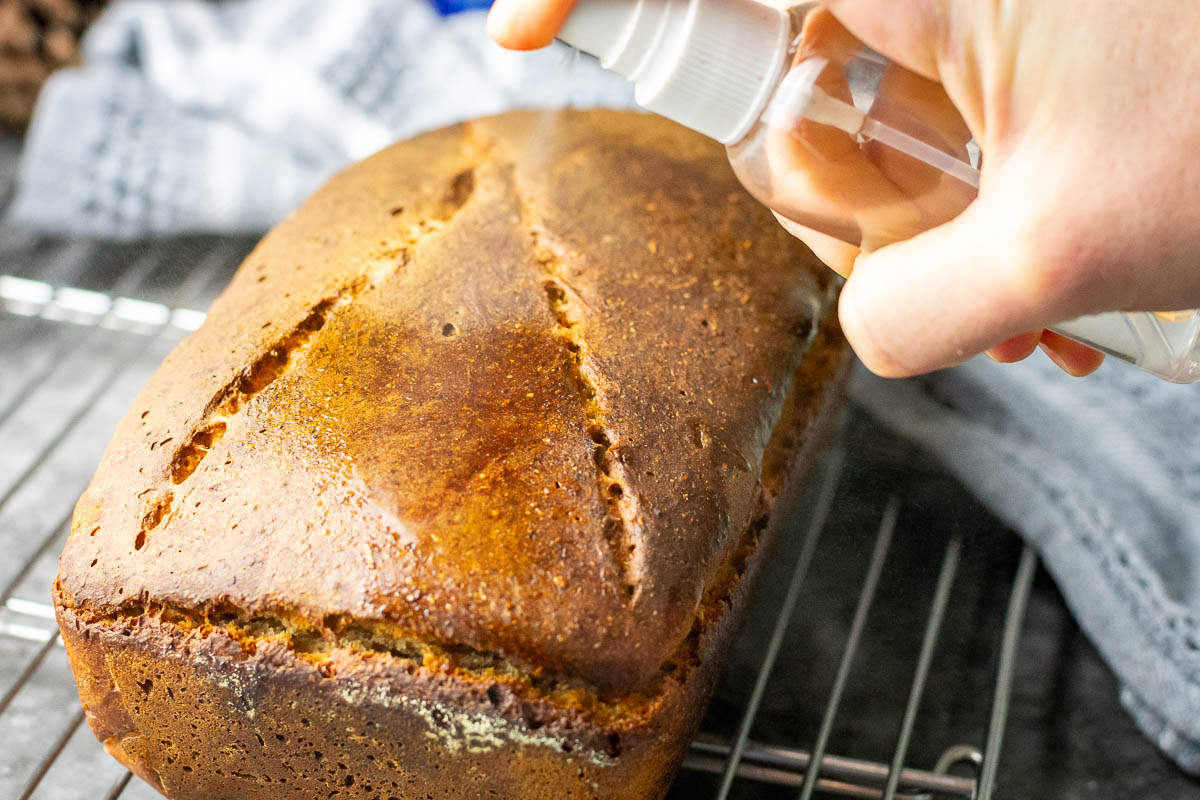 Spraying the crust of lithuanian bread with water.