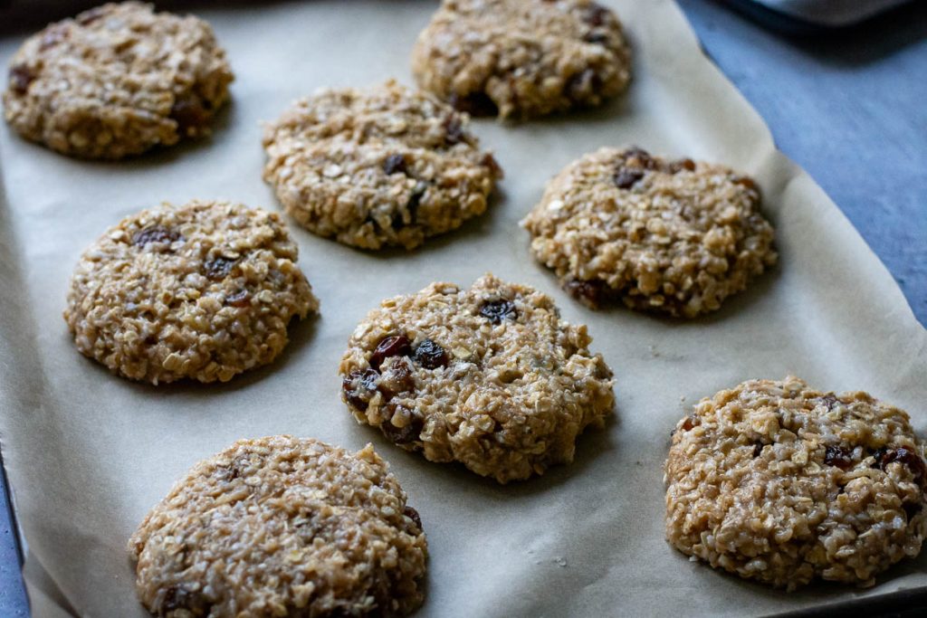 Flatenned banana, oatmeal, honey cookies before baking. 